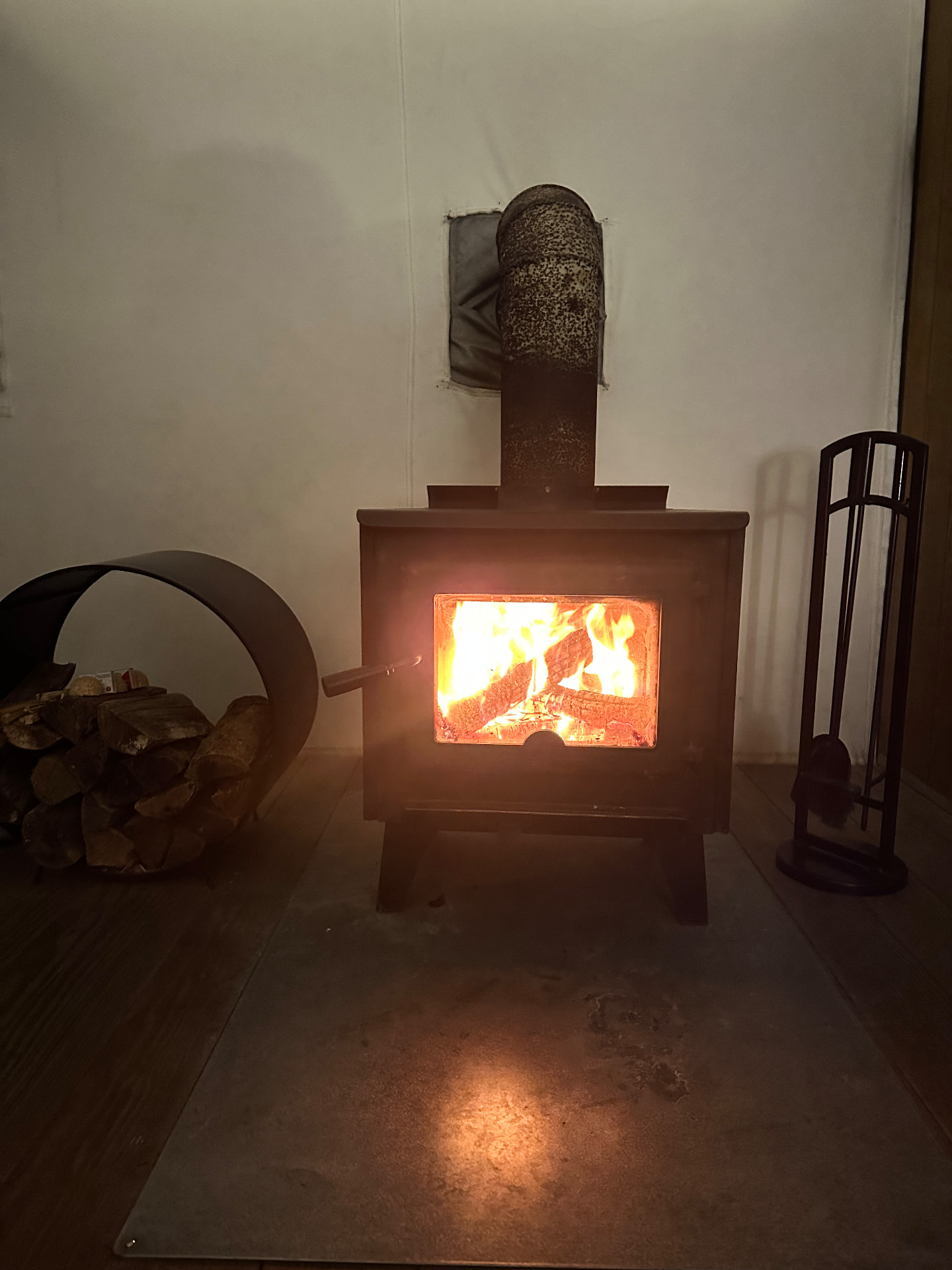 Wood-burning stove warming the tent