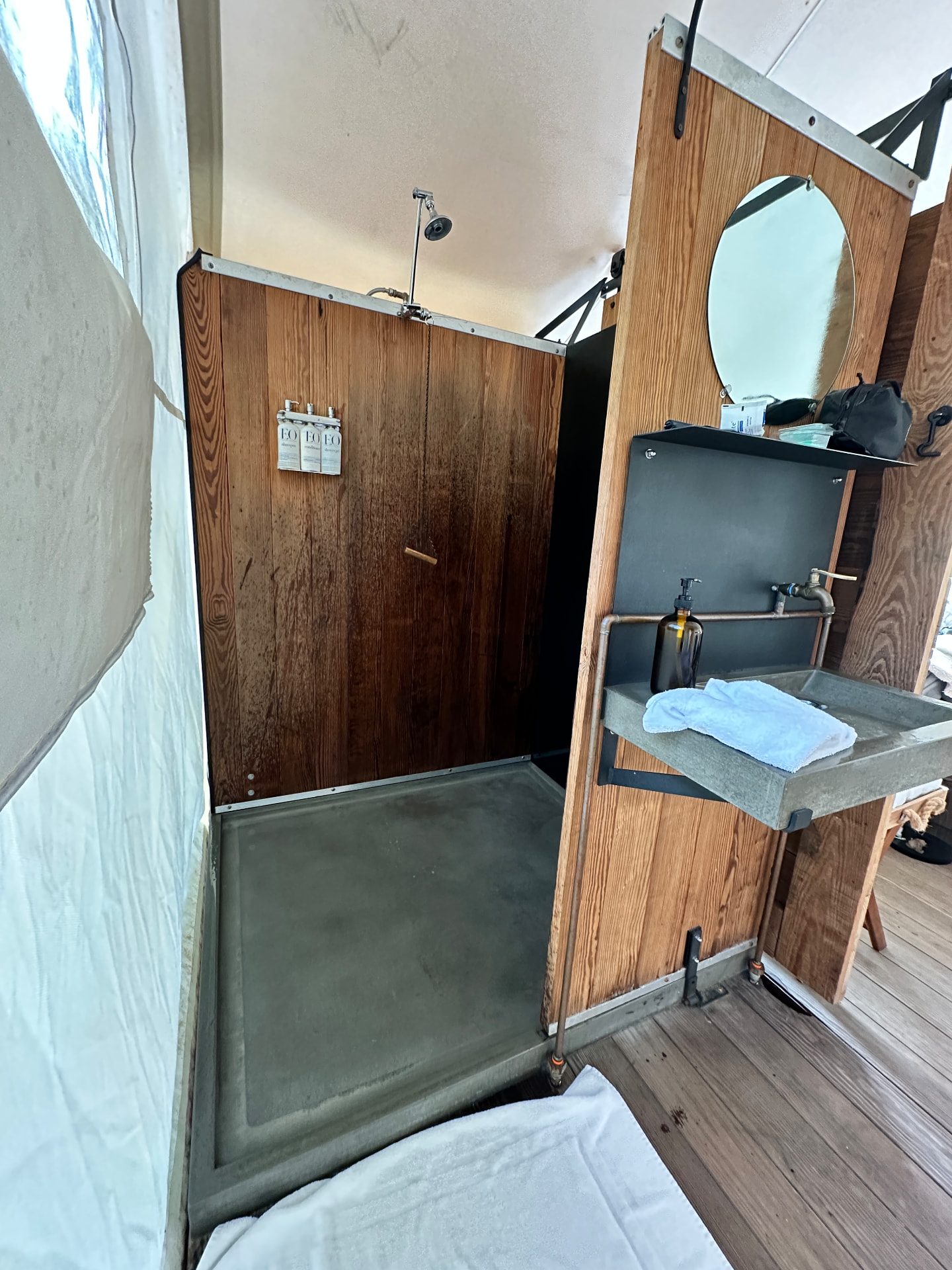 Private shower and sink inside the Under Canvas tent